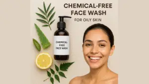 Flat lay of a chemical-free face wash bottle surrounded by natural ingredients like aloe vera, tea tree leaves, lemon slices, and neem on a white background.